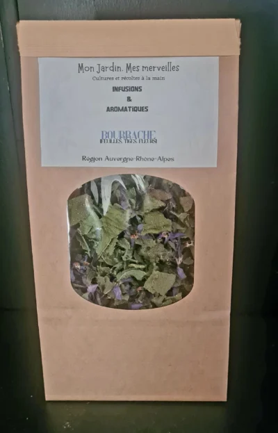 Sachet en papier kraft avec une fenêtre transparente laissant apparaître les feuilles, tiges et fleurs de bourrache sèches