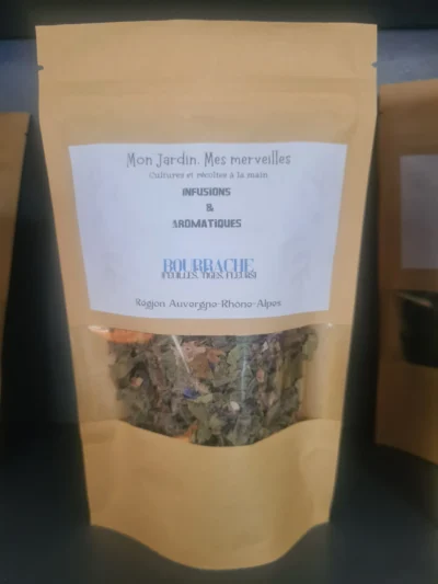 Sachet en papier kraft avec une fenêtre transparente laissant apparaître les feuilles, tiges et fleurs de bourrache sèches
